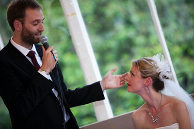 Groom making wedding speech with Bride